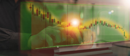 business man use technology tablet computer and cell phone to invest in stock for growth and see...