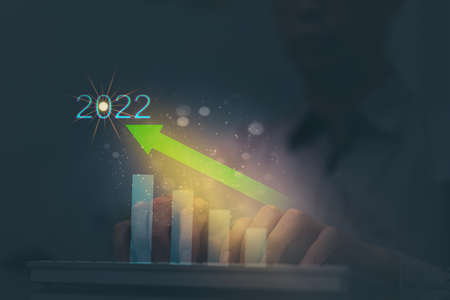2022 target use new year hand use metaverse for growth success of business online social network by communication of big data information technology show graph up profit easy connect internetの写真素材