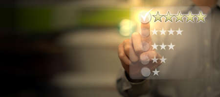 man press on five star excellent review for quality satification service or best positive business rate by customer evaluation in performance expirence conceptの写真素材