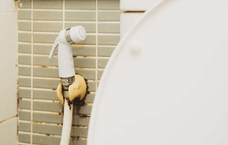 dirty water clean spray faucet or nozzle for wash buttの写真素材