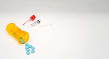 pills drug medicine tablets pour out bottle for supplement vitamin healthcare illness treatment concept in pharmacist open and label then spill them for prescribeの写真素材