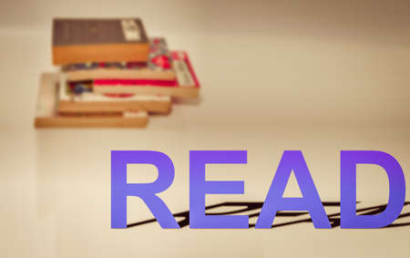 read word on blur stacks of books  high angle viewの写真素材