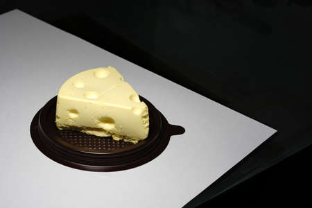 emmental swiss cheese in piece on table top viewの写真素材