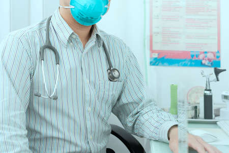 doctor person with stethoscpoe sits in hospital for diagnosis healthcare consult