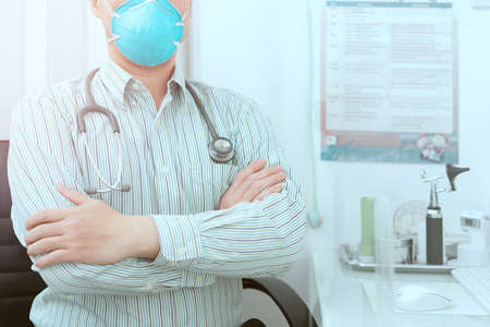 confident doctor with stethoscope in hospital