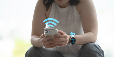 woman sits and connect exercise heart rate app to smart watch