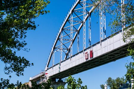 the bridge over the Canal against the blue sky