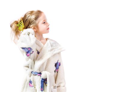 young girl with bathrobe on white backgroundの写真素材