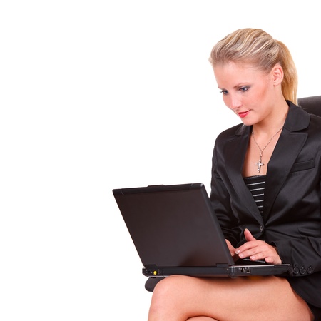 Sitting young happy business woman with notebookの写真素材