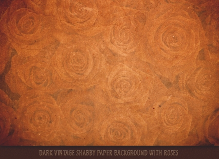 Dark vintage shabby paper background with rosesの写真素材