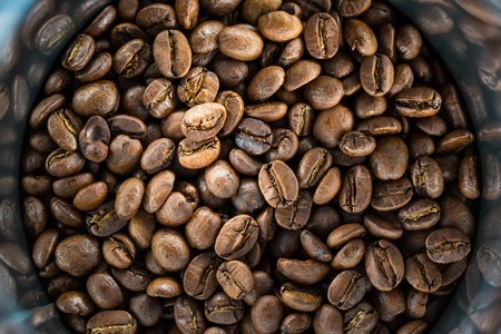 Coffee beans in metal jar. Image for your backgroundの写真素材