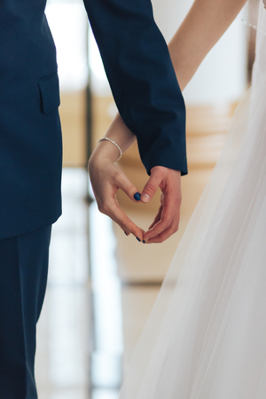 bride and groom holding handsの写真素材
