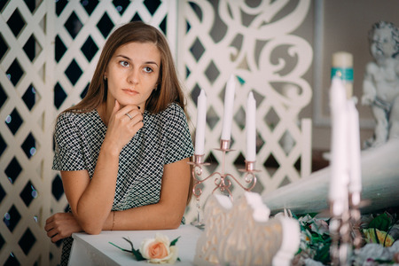 Beautiful sexy girl posing at the piano in photo studioの写真素材