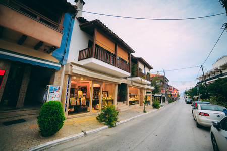 Ouranoupoli, GREECE - SEPTEMBER 23, 2014: Greek street with church shopsのeditorial素材
