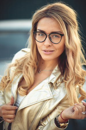 Close up view of beautiful woman lips with purple matt lipstick. Open mouth with white teeth. Cosmetology, drugstore or fashion makeup concept. Beauty studio shot. Passionate kissの写真素材