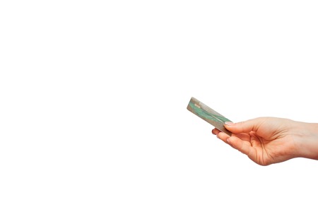 online purchase with a credit card. easy control and money management. womans hand holding a plastic...