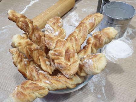 homemade sweet rolls in a wooden bowlの写真素材