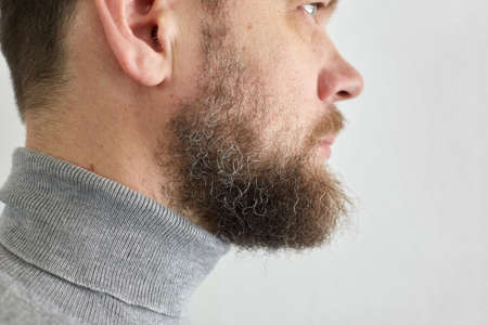 male short beard, portrait of a middle-aged man, side viewの写真素材