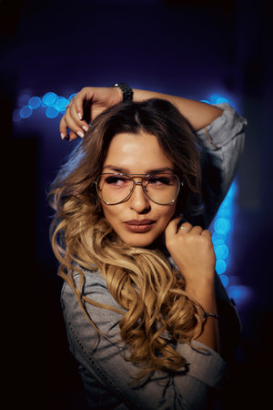 Close up view of beautiful woman lips with purple matt lipstick. Open mouth with white teeth. Cosmetology, drugstore or fashion makeup concept. Beauty studio shot. Passionate kissの写真素材