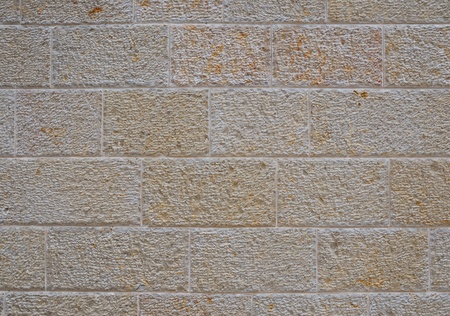 Decorative wall paved with natural sandstone light yellowish colorの写真素材