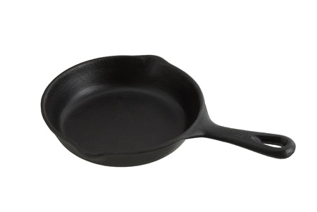 Black frying pan from cast iron isolated on white backgroundの写真素材