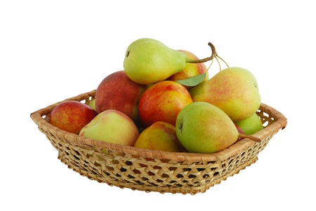 Fresh pears, peaches and nectarines in interwoven basket isolated on white backgroundの写真素材