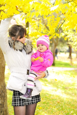 The little girl on walk with mumの写真素材