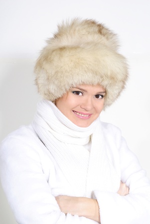 The young beautiful girl in fur on a white backgroundの写真素材