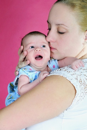 The little boy with the big eyes at mum on handsの写真素材
