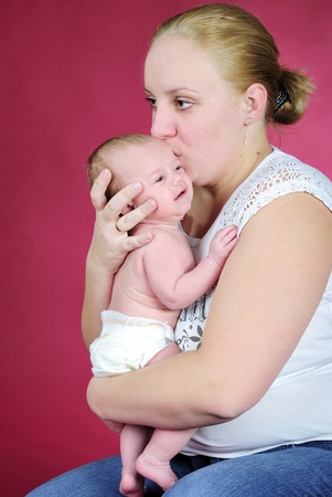 The little boy with the big eyes at mum on handsの写真素材