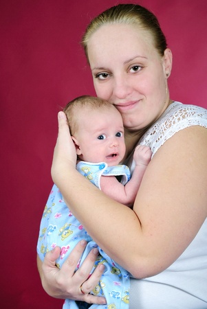 The little boy with the big eyes at mum on handsの写真素材