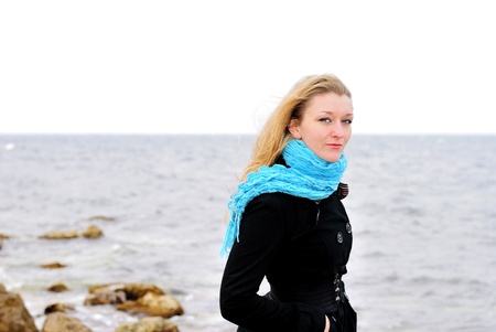 The young beautiful girl near the sea の写真素材