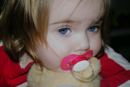 small beautiful girl with nipple and plush bear