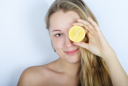 younger beautiful girl with citrus fruitの写真素材