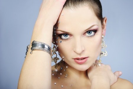 beautiful girl fashionable on white background with bright diamondの写真素材