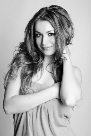 young beautiful girl in rose long year peasant woman's dress with long hair on white backgroundの写真素材