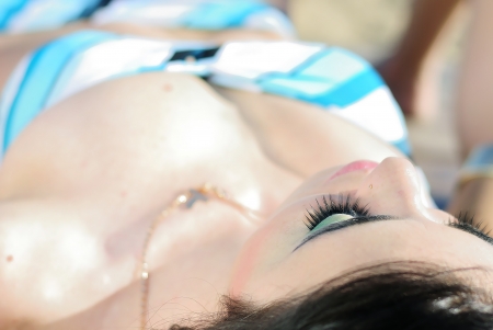 Graceful girl in blue swimsuit on sailboat
の写真素材