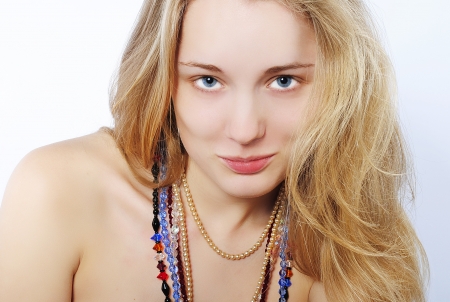 Portrait of the beautiful girl in costume jewelleryの写真素材