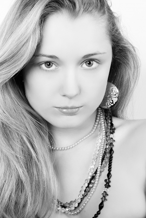 Portrait of the beautiful girl in costume jewelleryの写真素材