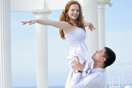 beautiful young couple in love on the beachの写真素材