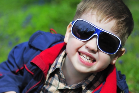 smiling little boy with glassesの写真素材