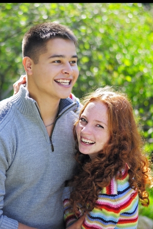 Young beautiful couple in parkの写真素材