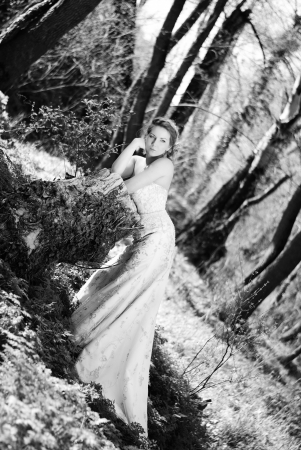 beautiful girl bride in green wood by summerの写真素材