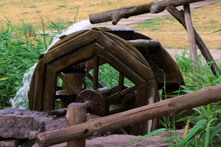 Water-mill at a lake in a parkの写真素材