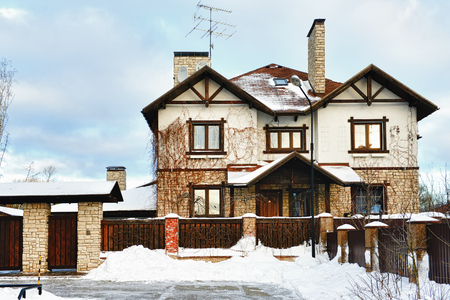 Russia, a country house in the winter with white snowの写真素材