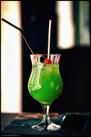 green cocktail is on the table