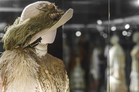 mannequin in a hat and dress with feathers in the old style.の写真素材