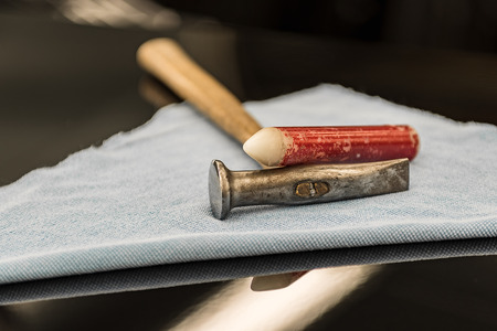 Special tools to eliminate metal defects from the car body, hammer, peg close-upの写真素材