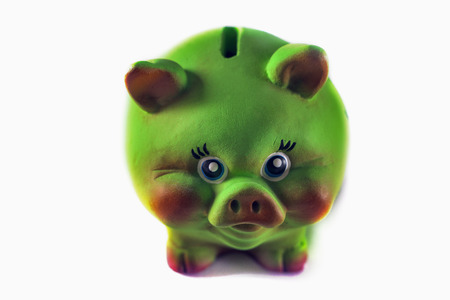Green ceramic piggy Bank on white backgroundの写真素材