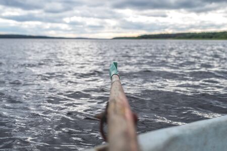 boat oar in the water and splashing waterの写真素材